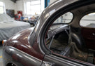 D-post seal fitted to the rear pillar of a dark grey classic Jaguar saloon