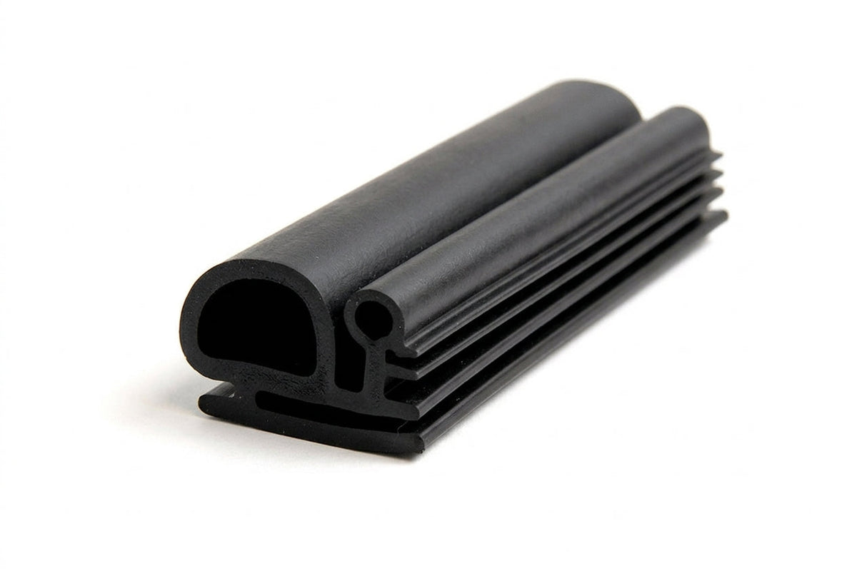 Black rubber seal with ribbed fin and bulb profile, coiled length on white background