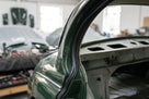 D-post seal fitted to the rear pillar of a green classic Jaguar saloon