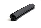 Black rubber seal with barbed leg, curved length on white background