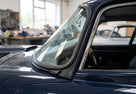 Door seal fitted along the windscreen frame of a dark blue classic Jaguar E-Type