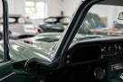 Door seal fitted along the frame of a green classic Jaguar E-Type