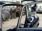 Door seal fitted along the door frame of a dark blue classic Jaguar E-Type