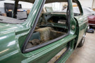 Lower door seal fitted to the sill of a green classic Jaguar saloon