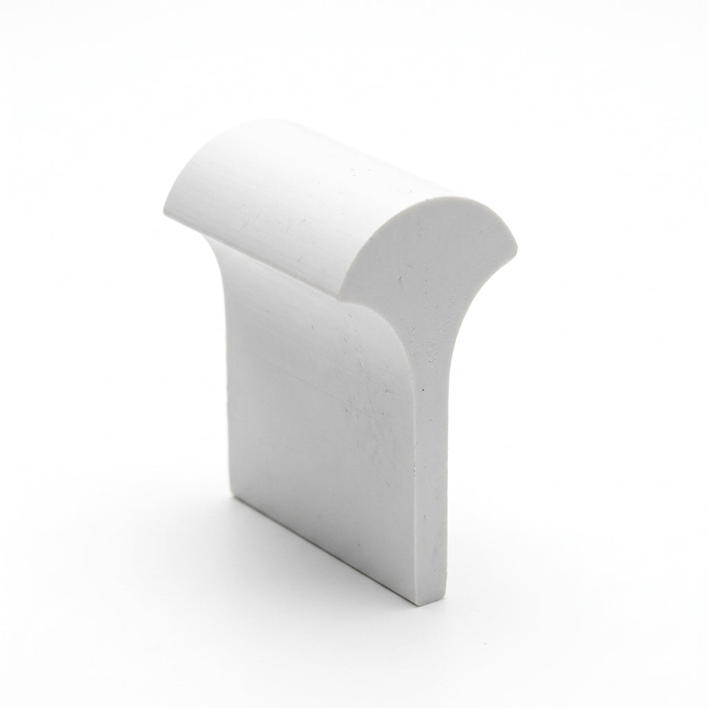 White PVC filler/locking strip shown as a 3D moulded profile shape, studio shot