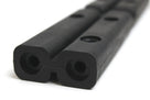 Black rubber tailboard section with twin bolt holes, close-up studio shot