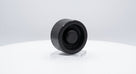 Round black rubber bonnet buffer on a stand, side view, white background
