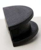 Black rubber cambox end plug shown side-on, stepped disc profile
