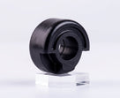 Black rubber seat buffer with central hole, angled studio shot on stand