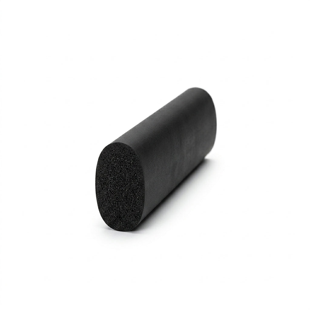 Short length of black sponge rubber cord at an angle, cut end showing porous texture