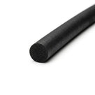 Black sponge rubber cord at an angle, close-up on the round cut end showing porous texture