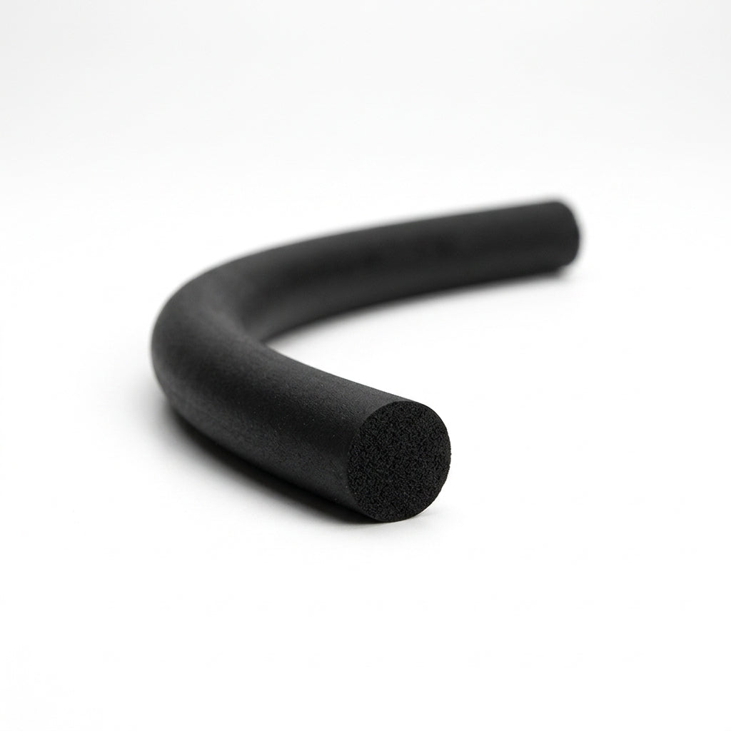 Black sponge rubber cord curved into a hook shape on a white studio background