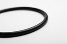 Close-up of a black nitrile O-ring showing its round cross-section