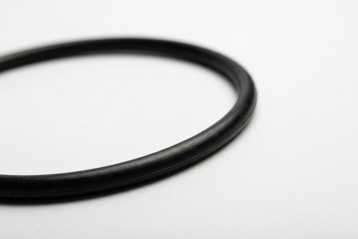 Close-up of a black nitrile O-ring showing its round cross-section