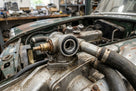 Nitrile O-ring fitted to a heater valve on a classic car engine in a workshop