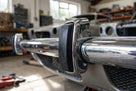 Black rubber overrider cap fitted to the end of a chrome Triumph Stag bumper