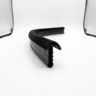 Black flocked outer waist strip profile shown end-on against white background