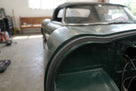 Self-adhesive foam strip fitted along a green convertible's wing edge