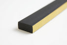 Black closed-cell foam strip shown with its gold adhesive backing paper peeled back