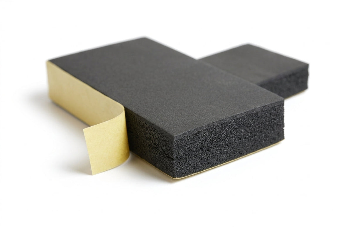 Black foam strip blocks shown with gold adhesive backing partly peeled back