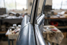 Chrome window trim on a classic car, foam strip fitted beneath the join