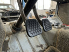 Two cross-hatch pedal pads fitted in a stripped-out Land Rover cabin
