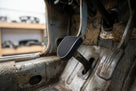 Cross-hatch pedal fitted in a stripped, rusty Rover P6 footwell