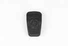 Black ribbed accelerator pedal pad with embossed logo, studio white background