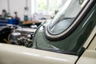 PVC chrome filler/locking strip fitted around a green classic car's windscreen edge