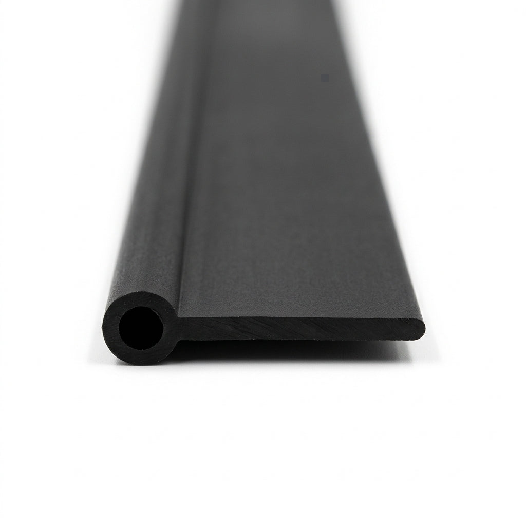 Black PVC wing piping shown end-on, hollow bead with wide flat tail profile