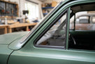 Quarterlight seal fitted around a green Escort Mk1 4-door's rear side window