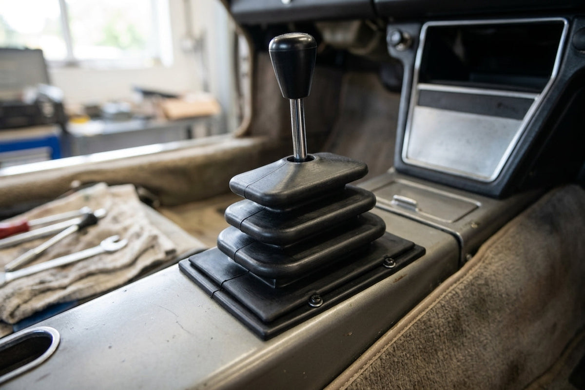Gaiter fitted around the gear lever on the centre console of a classic car
