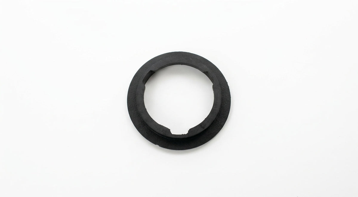 Black rubber ring-shaped cushion viewed from above on a white background