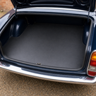Black rubber matting fitted in the boot of a classic car