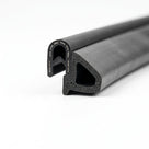 Coiled black self-grip rubber seal showing triangular sponge section, close-up