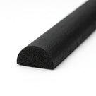 Long black half-round sponge rubber extrusion, close-up on the cut end showing porous texture