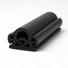 Black D-section sponge rubber with mushroom-shaped internal void and finned mounting base, cut end