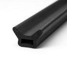 Black sponge rubber seal with T-shaped fin, angled length shot on white background