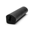 Black sponge rubber seal with teardrop channel, coiled length on white background