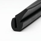 Black sponge section seal with textured dual-hardness bulb, close-up angled shot