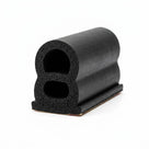 Black sponge rubber seal with adhesive tape backing, figure-8 profile, angled studio shot