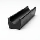Black U-channel rubber seal profile, studio white background