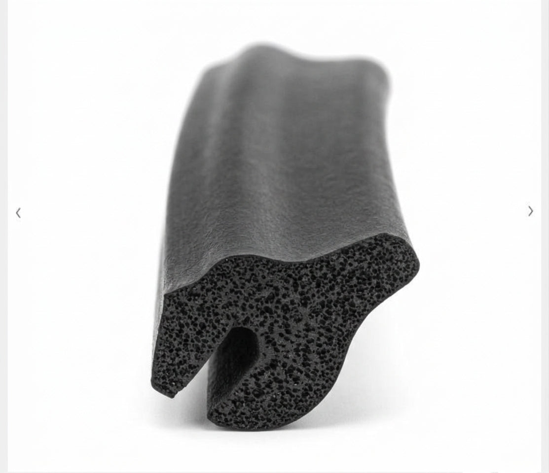 Black rubber boot lid seal, end-on view showing textured D-shaped profile
