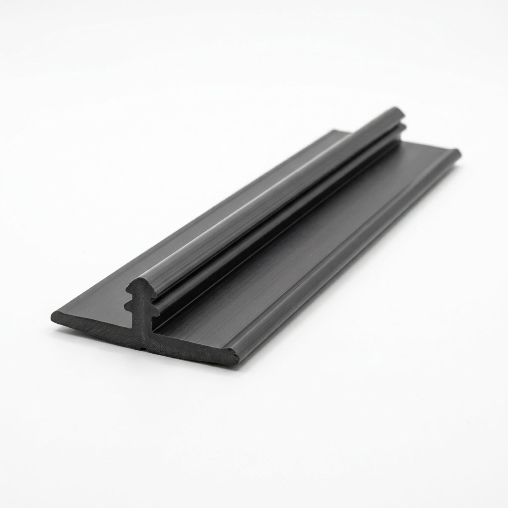 Black knock-on trim shown at an angle with a flat ribbed base plate