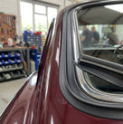 Black edge trim shown at an angle, with a metal strip along one edge