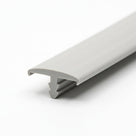 Light grey trim shown at an angle with a single lip and T-shaped fixing clip