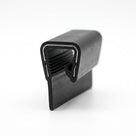 Short block of black PVC edging strip with comb-toothed grip on one leg and hooked clip on the other