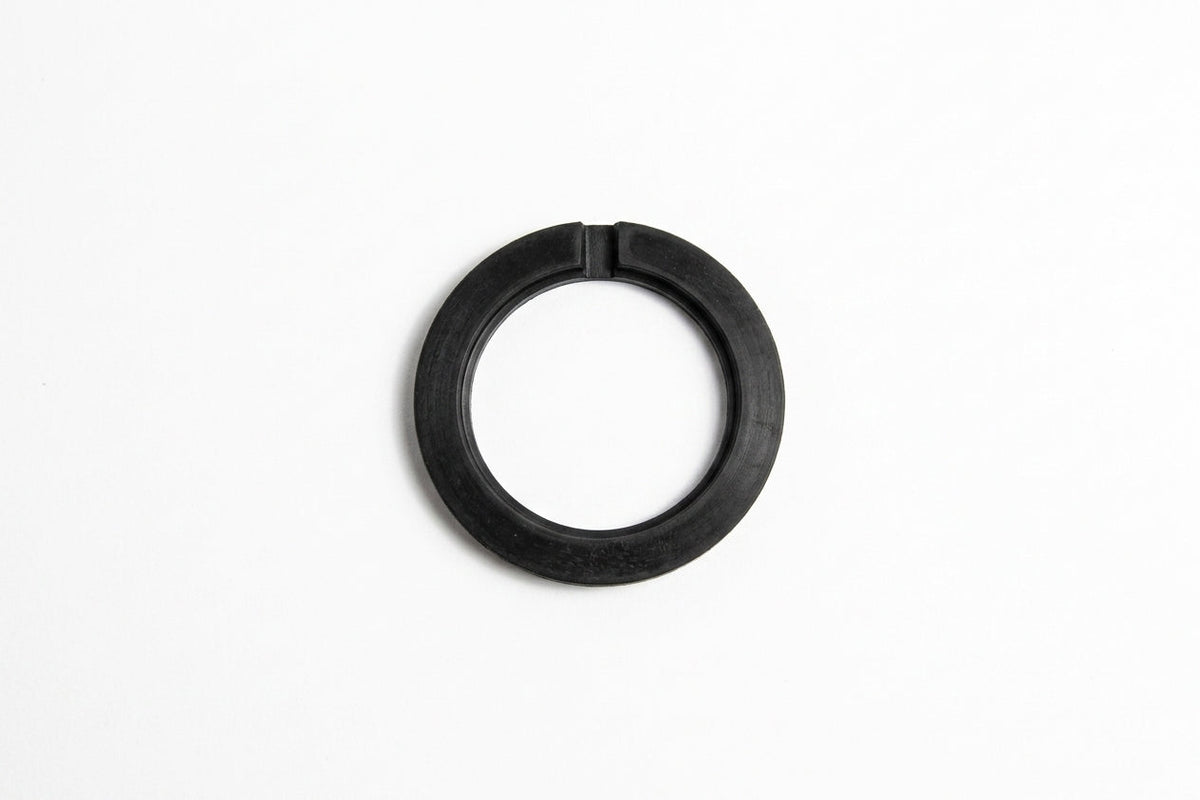 Black rubber sump sealing washer, flat top-down view on white background