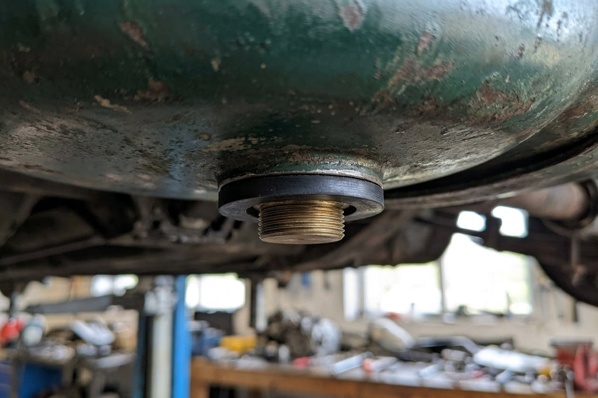 Sealing washer fitted to a fuel tank sump drain plug on a vehicle