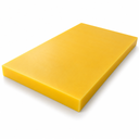 Yellow polyethylene slab angled on white, thick square-cut edge along the near side